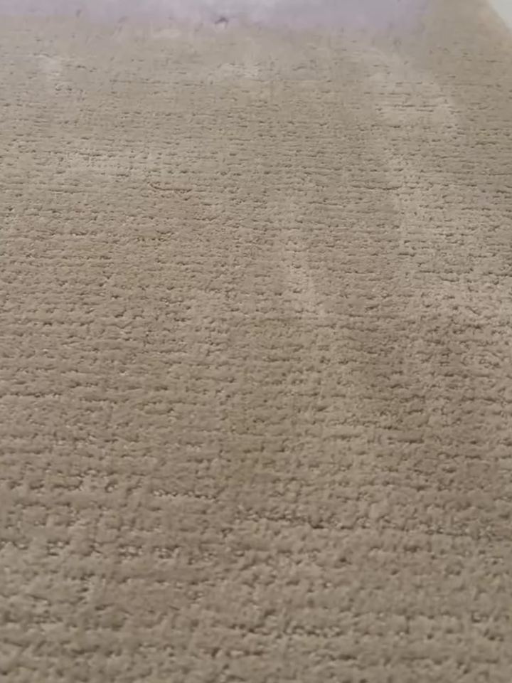 After: the burn patched with matching carpet, pattern lined up, nearly impossible to find